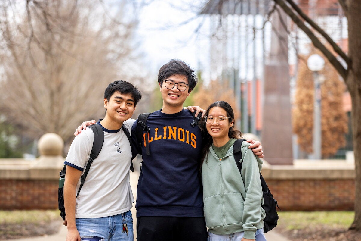 Three students pose together outside of the Siebel Center.