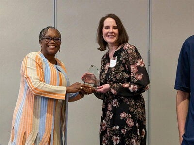 Jamie Thomas-Ward receives her AP Award from Dean Patton