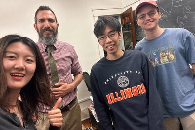 Helen Wu (Class of '26) snaps a selfie with DiIanni and two of her classmates at office hours.