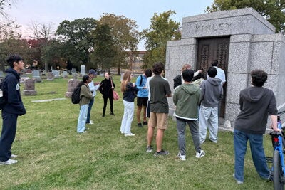 The Grave Walkers peek into Kinley's mausoleum.